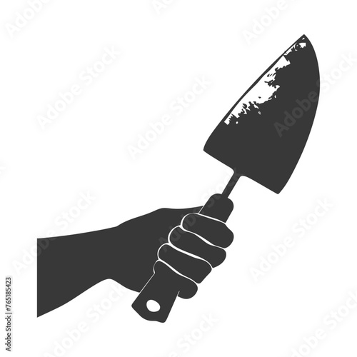 Silhouette hand holding brick trowel for construction black color only