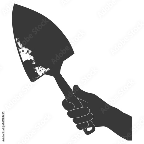 Silhouette hand holding brick trowel for construction black color only
