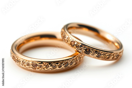 Exquisite Gold Wedding Bands Adorned with Stones on a Pure White Background, Radiating Elegance