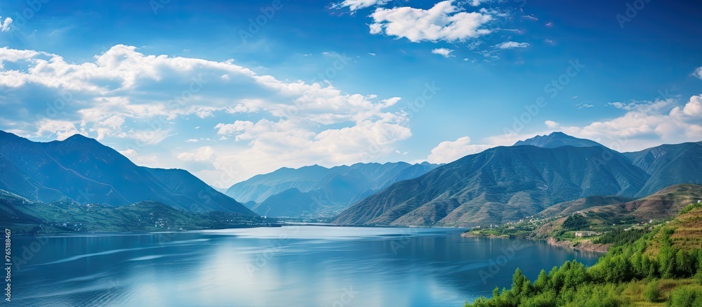 Lake surrounded by mountains and forest