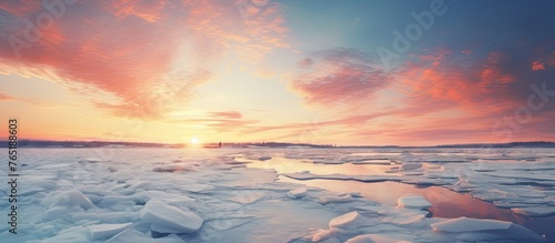 Colorful sunset on frozen lake with ice © Ilgun