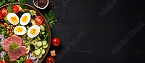 Plate of assorted food on dark surface