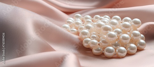 Pearl brooch on satin fabric