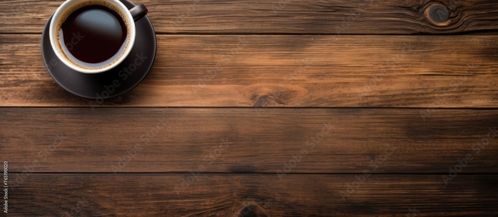 A steaming mug on a wooden surface A steaming mug on a wooden surface