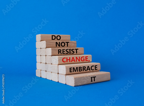 Do not resist change embrace it symbol. Concept words Do not resist change embrace it on wooden blocks. Beautiful blue background. Business concept. Copy space. photo