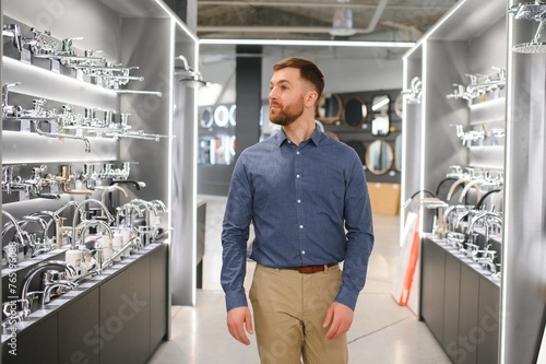 Man chooses a products in a sanitary ware store