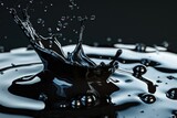 Beautiful oily splash with drops on a black background