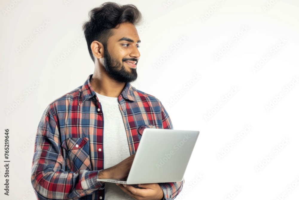 Smiling young man with laptop dreaming and thinking. Smiling young man with laptop dreaming and thinking.