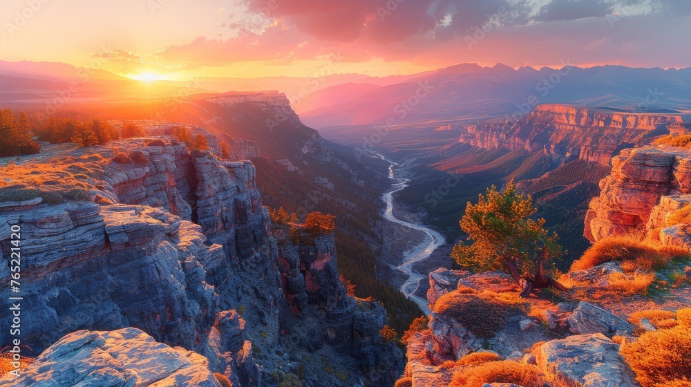 The sun sets over a canyon with a river, creating a beautiful natural landscape