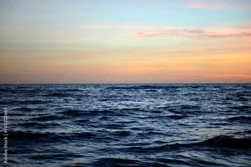 Dramatic red ocean waves at sunset with soft evening sea dark water Dramatic red ocean waves at sunset with soft evening sea dark water