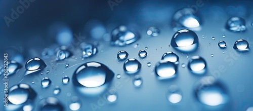 Capturing the intricate details, this image shows a cluster of tiny water droplets scattered across a smooth surface