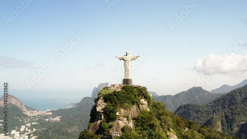 Aerial Panning Shot Of Famous Statue Of Jesus Christ On Rock Formation During Sunny Day - Rio de Janeiro, Brazil