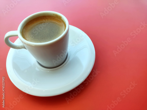 Cup of coffee and Pyrex on the red background with copy space for design. Ready template, banner Business presentation	
