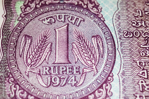 Closeup of old one Rupee India currency banknote (focus on center)