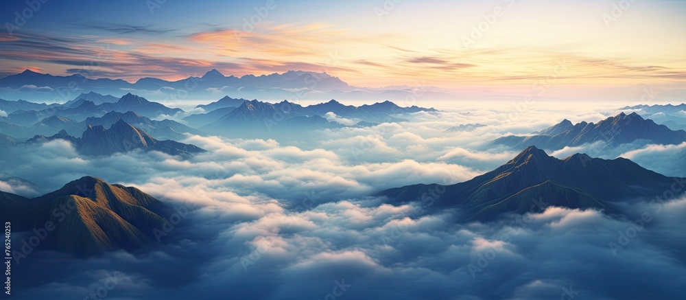 A scenic view of towering mountains under a cloudy sky in the background