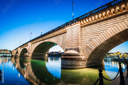 Tourists near the old London Bridge at sunset, which was relocated from London England in the 1970’s to Lake Havasu Arizona.