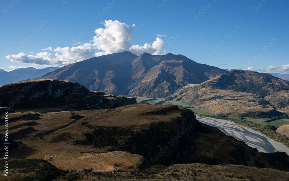 Hiking on vacation in New Zealand in a mountain landscape near Wanaka and Queenstown