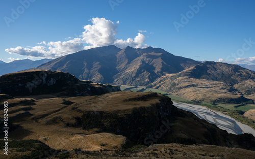 Hiking on vacation in New Zealand in a mountain landscape near Wanaka and Queenstown