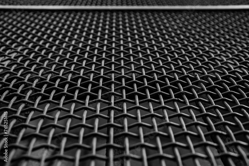 Close-up of a grate with a pattern of intertwined iron wires, Italy