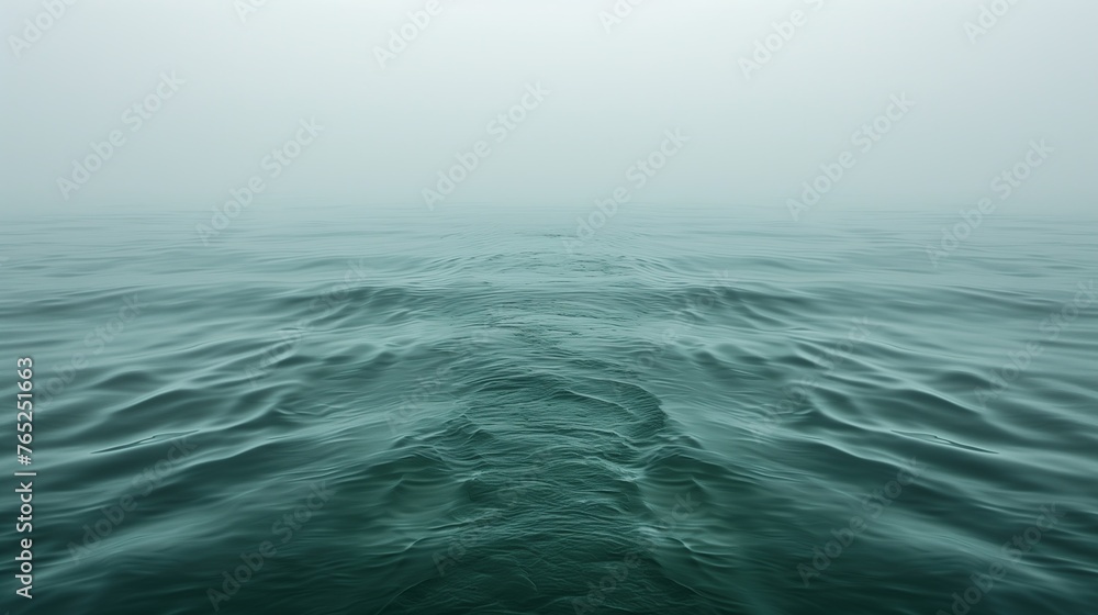 Misty Ocean Scene: Green Toned Seascape with Gentle Waves