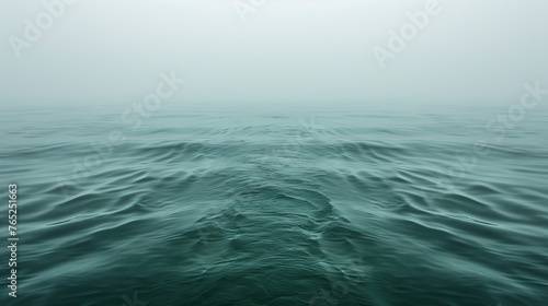 Misty Ocean Scene: Green Toned Seascape with Gentle Waves