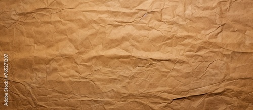 A closeup photo showcasing the intricate pattern of a crumpled brown paper, with hints of beige and amber resembling wood flooring. The rectangle shape highlights the peach tints and shades