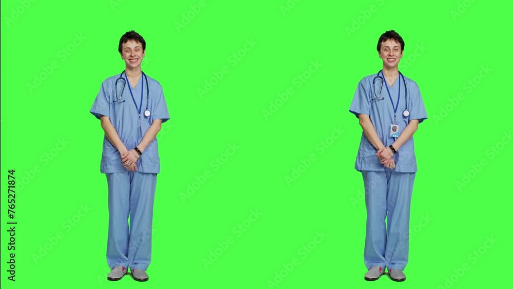 Joyful medical assistant greeting patients with a smile and waving, saying hello in studio against greenscreen backdrop. Smiling cheerful nurse welcoming people at healthcare clinic. Camera A. Joyful medical assistant greeting patients with a smile and waving, saying hello in studio against greenscreen backdrop. Smiling cheerful nurse welcoming people at healthcare clinic. Camera A.