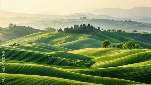 A Rolling green hills of farmland create a soothing pattern of agricultural beauty in a panoramic landscape.