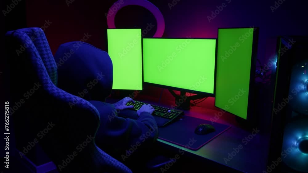 Computer with chroma key green screen on monitor. Gamer man playing in popular video games. Programmer or hacker coding a code and working in networks, cyberspace. Digital software, mobile app Computer with chroma key green screen on monitor. Gamer man playing in popular video games. Programmer or hacker coding a code and working in networks, cyberspace. Digital software, mobile app