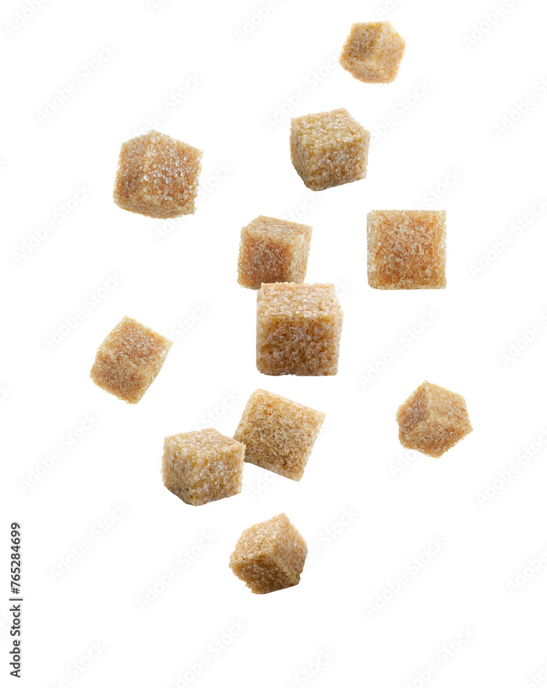 Brown cane sugar cubes falling on white background Brown cane sugar cubes falling on white background