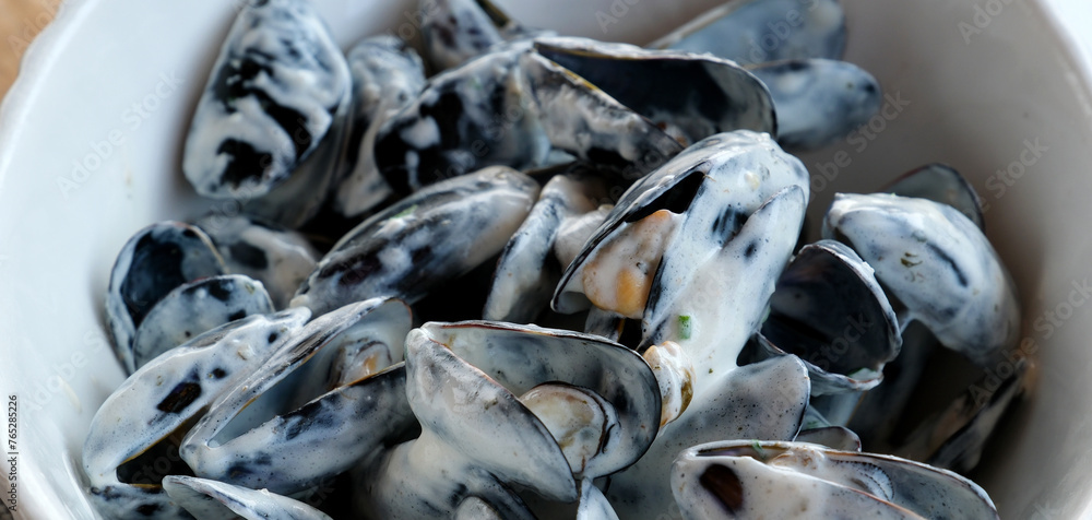 close up of marinieres mussels, a French recipe with shallot and white wine close up of marinieres mussels, a French recipe with shallot and white wine
