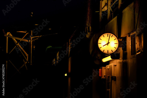 Industrial clock at night