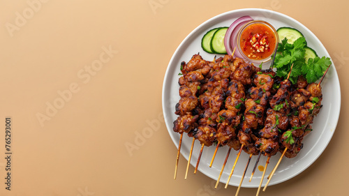 Top view of asian traditional satay isolated on beige background