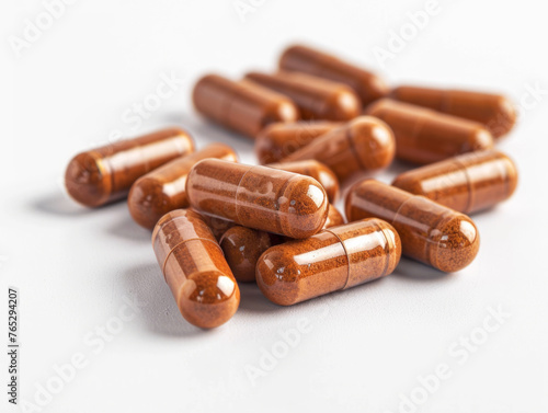 Turmeric Capsules Scattered on a White Background