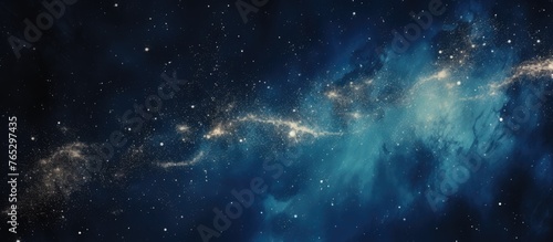 An image featuring a blue celestial galaxy filled with stars set against a deep black background © TheWaterMeloonProjec