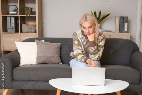 Mature woman with laptop vi...