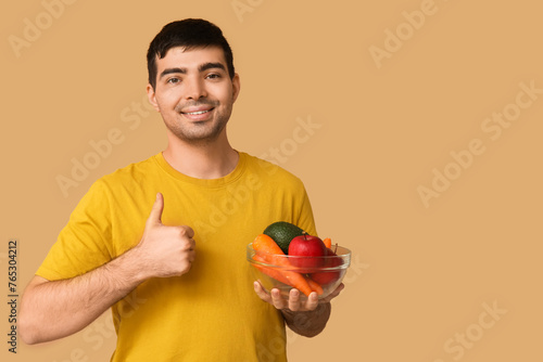 Young man with food rich in...