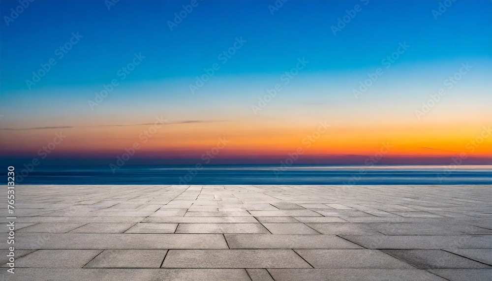 empty concrete floor against the backdrop of the ocean at sunset