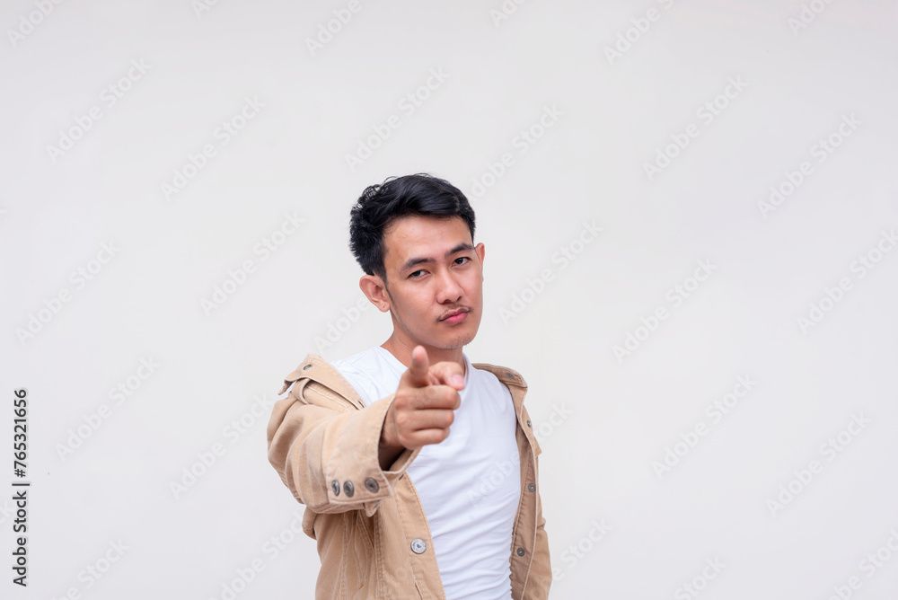 Confident Asian man pointing at the camera, isolated on white Confident Asian man pointing at the camera, isolated on white