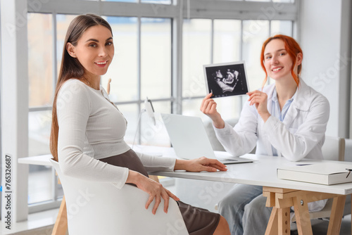 Young pregnant woman and do...