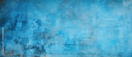 An artistic closeup of an electric blue wall with a grunge texture resembling a liquid painting. The pattern resembles a natural landscape horizon in a rectangle shape