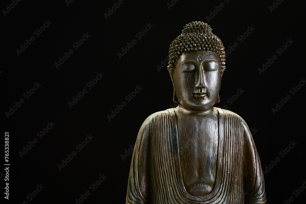 Buddha statue with black background 