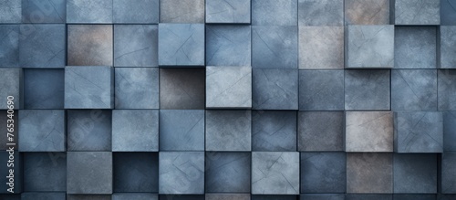 A closeup of a grey rectangular wall made of composite material with blue tinted square tiles creating an electric blue facade
