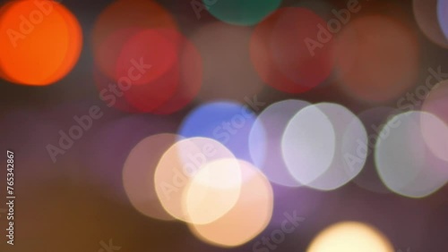 Jakarta, Indonesia - July 2, 2023: glittering bokeh from car lights in street