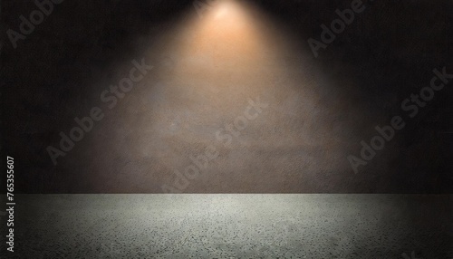 abstract spacious place with dark wall granular floor and spot light from above photo