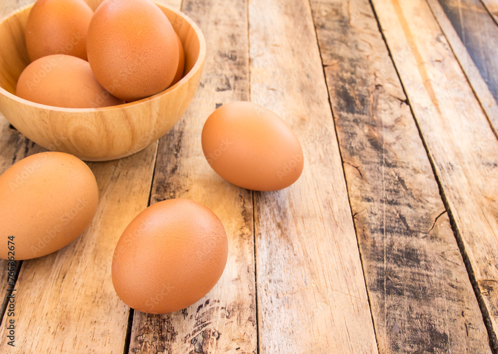 Chicken brown eggs on wooden background Chicken brown eggs on wooden background