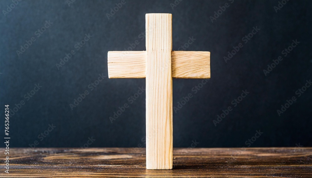 wooden cross on black background