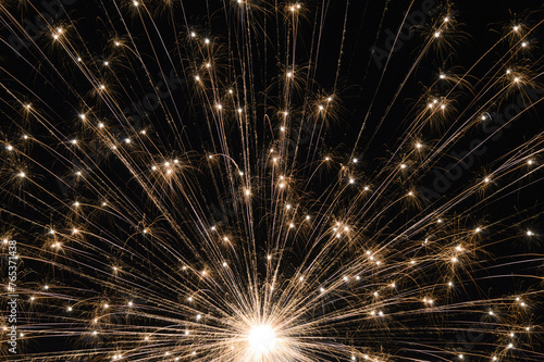 Firework burst in night sky closeup 