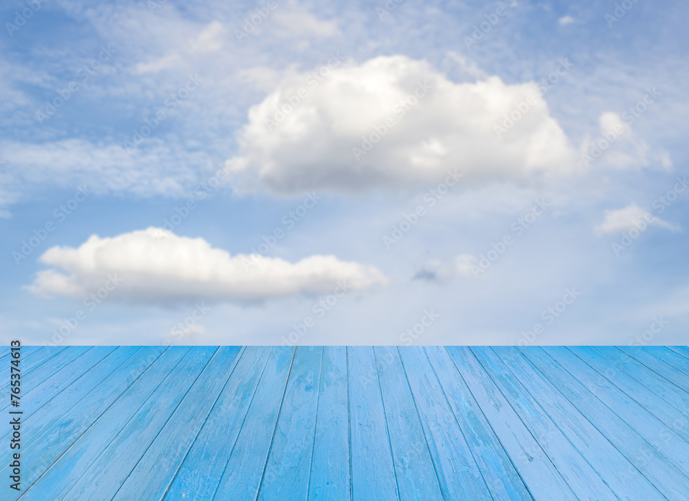Blue wooden table with sky background Blue wooden table with sky background