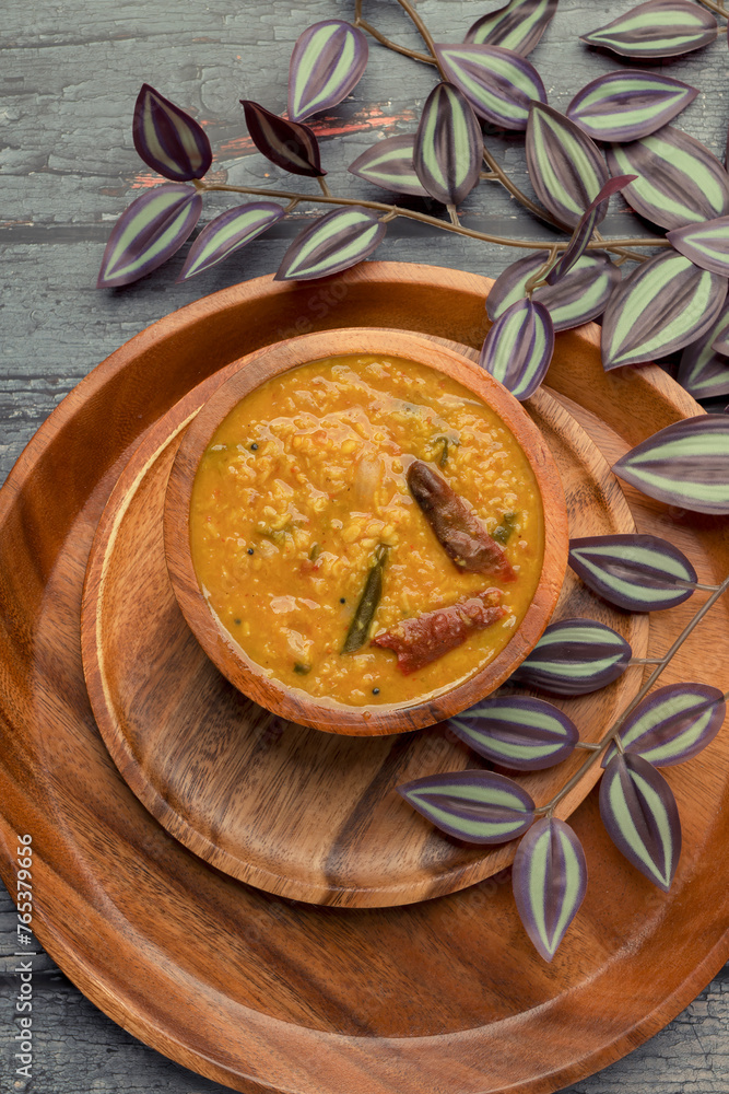 Fototapeta premium Indian traditional food Mung Dal Tadka Curry served for rice and chapati. Also called Dal Tadka Curry , Dal Sambar, Dal khichadi or Khichdi Tasty Indian recipe made of yellow moong dal.